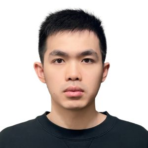 Young Asian man with short dark hair wearing a black t-shirt