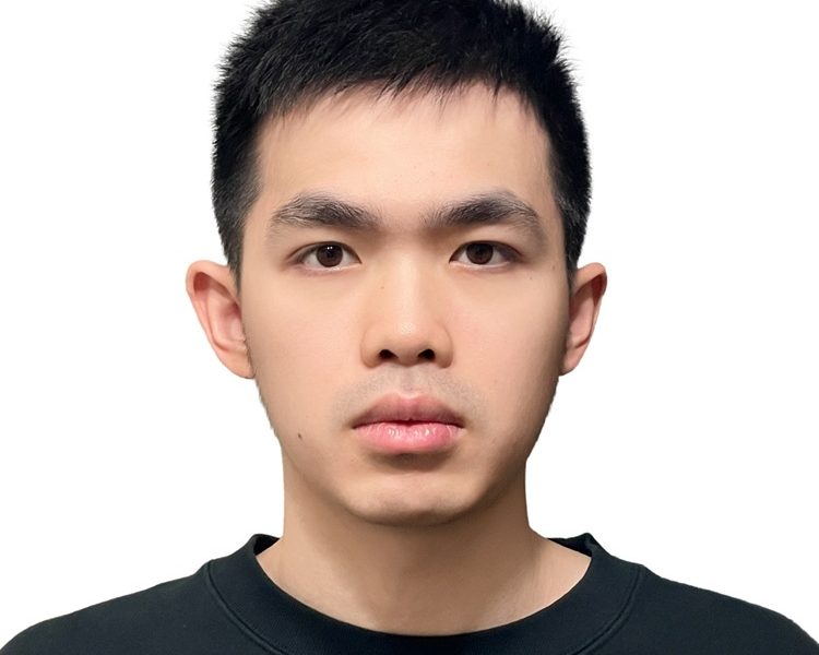 Young Asian man with short dark hair wearing a black t-shirt