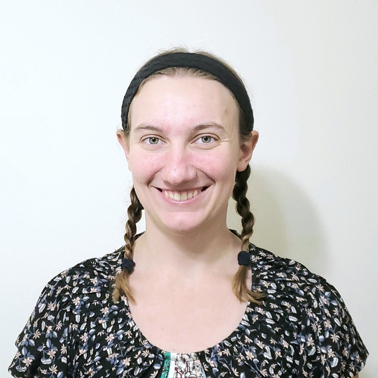 woman with braids smiling