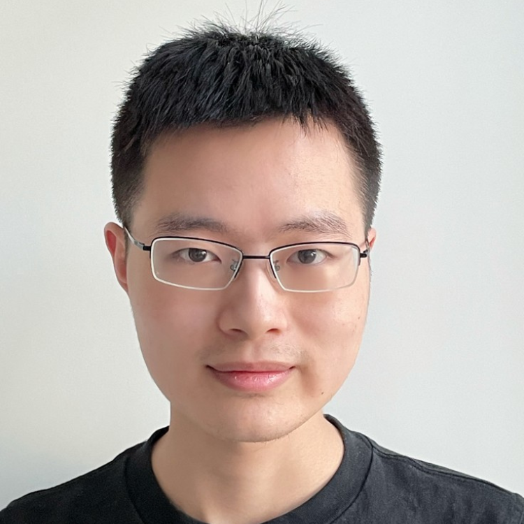 Man with glasses smiling